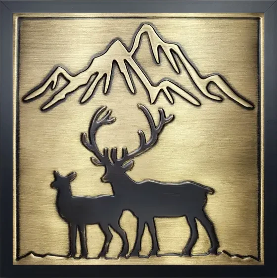 Deer and mountains on framed brass tile