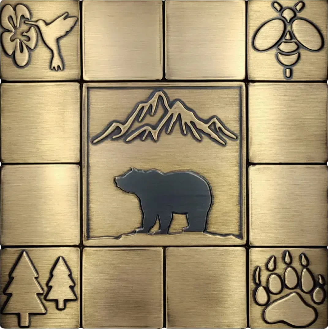 Bear and mountains on brass tile