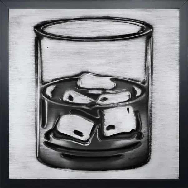 A glass of whiskey on steel tile in wooden frame