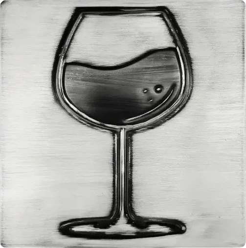 A glass of wine on stainless steel tile