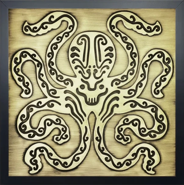 brass tile with Octopus motif in wooden frame