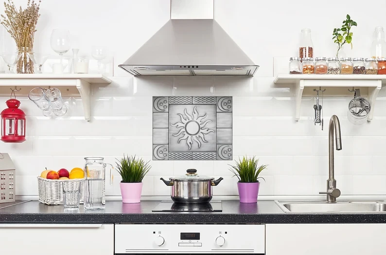 Sun, moon, stars on metal tiles backsplash