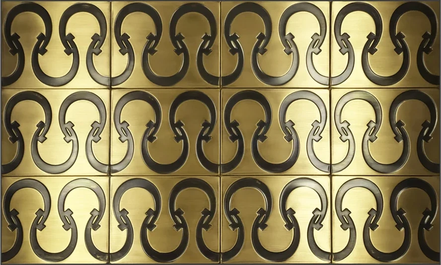Metal wall tiles with horseshoe pattern brass version