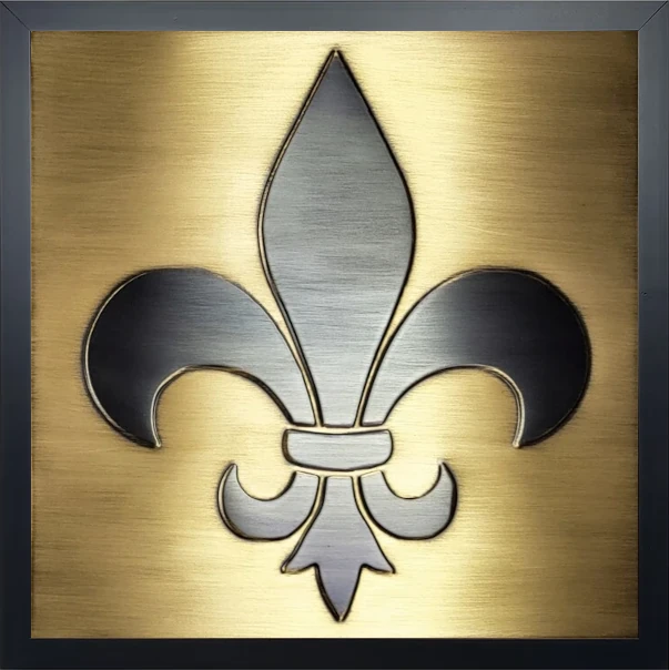 Fleur de lis brass tile in wooden frame